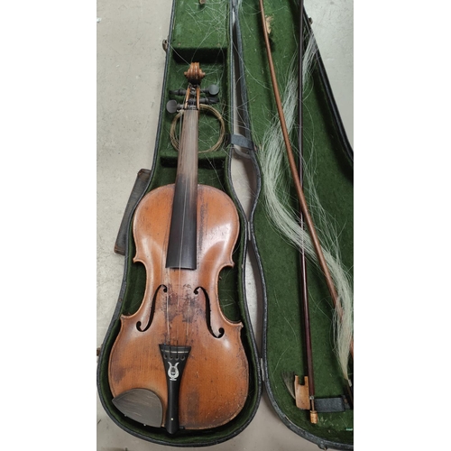 146A - A late 19th/early 20th century violin with single piece back, mother of pearl inlay to saddle with t... 