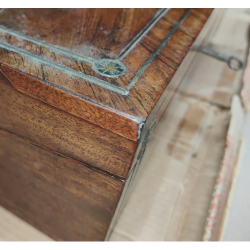 106 - A Victorian lap desk in crossbanded walnut and rosewood, with extensive brass inlay and fitted inter... 