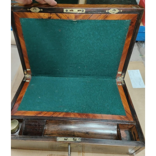 106 - A Victorian lap desk in crossbanded walnut and rosewood, with extensive brass inlay and fitted inter... 