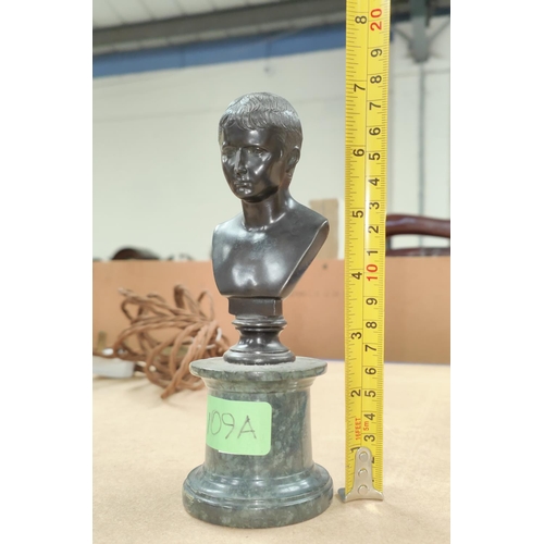 109a - A small classical style bronze, head and shoulder bust of a young man, on marble column