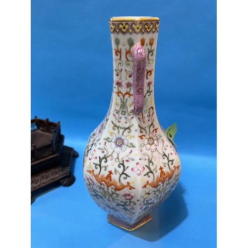 464 - A Chinese porcelain vase of hexagonal baluster form with loop handles, polychrome stylised floral de... 