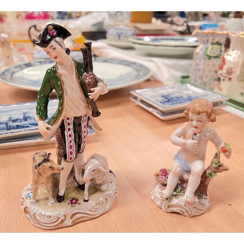 579 - A late Meissen figure:  man in 18th century dress with bagpipes and sheep, crossed swords mark; a se... 