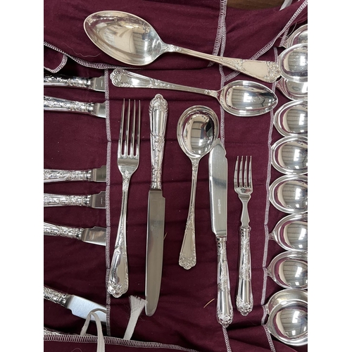 718 - A canteen of silver plated cutlery with scroll and acanthus decoration, 12 settings approx