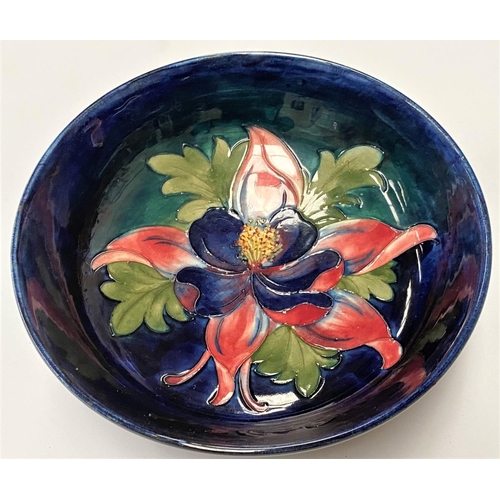 507 - A Moorcroft blue ground large bowl Columbine pattern, dia. 23.5cm, signed WM