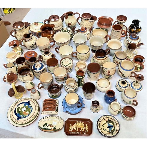 575 - A large selection of motto pottery, mainly cream and brown