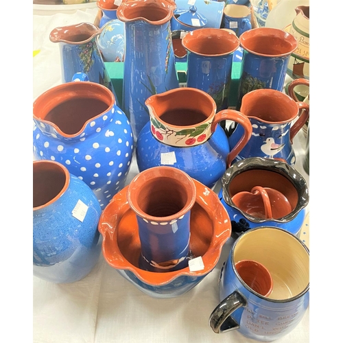 576 - A large selection of motto pottery, mainly blue