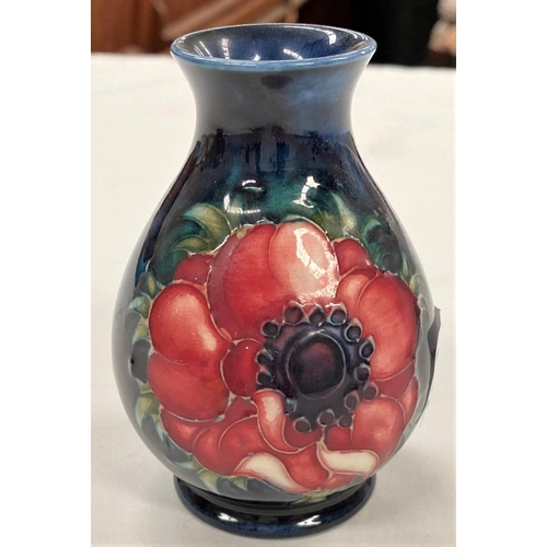 620 - A Moorcroft Anemone Vase with blue ground, height 9cm.