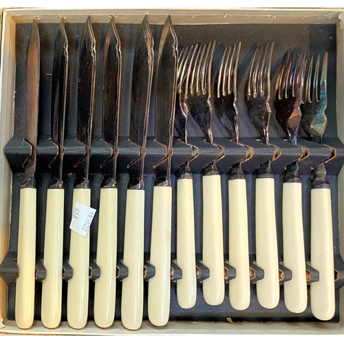 658 - An ornate set of teaspoons and tongs, pastry forks, etc., cased; other cased cutlery