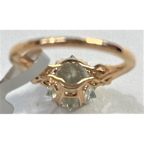 666 - A lady's 9 carat gold dress ring set Wobito snowflake cut prasiolite stone, 4.12 carat, flanked by 4... 