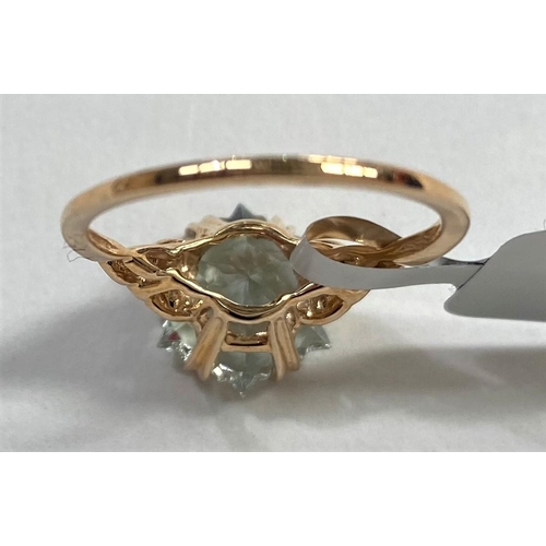 667 - A lady's 9 carat gold dress ring set central large Wobito snowflake prasiolite, 4.11 carats, ea... 