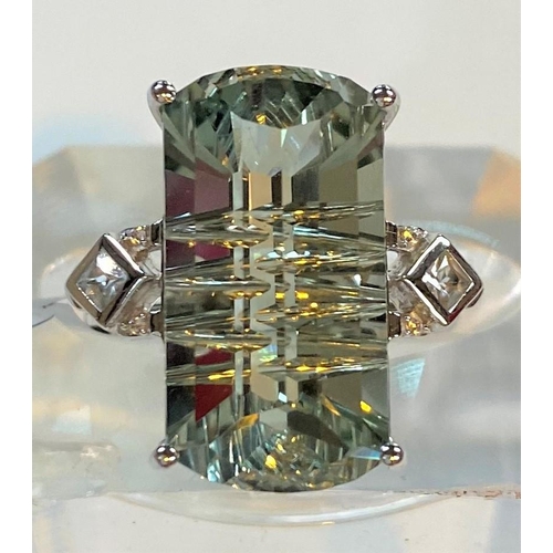 671 - A '9K' white gold dress ring set large Lehrer matrix cut prasiolite, 10.6 carat, and white zircon, s... 