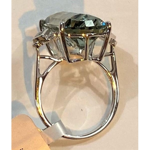 671 - A '9K' white gold dress ring set large Lehrer matrix cut prasiolite, 10.6 carat, and white zircon, s... 