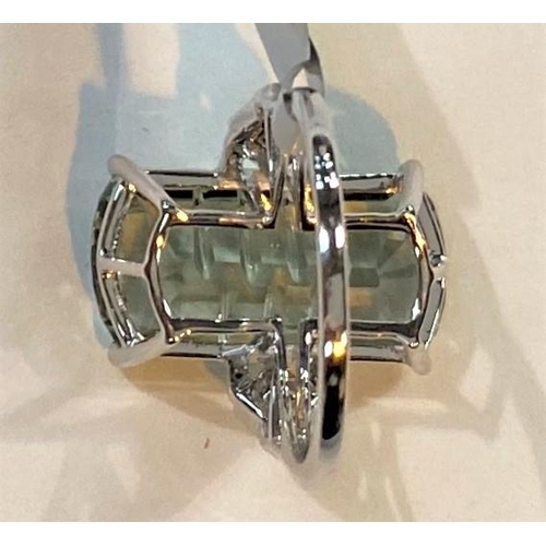 671 - A '9K' white gold dress ring set large Lehrer matrix cut prasiolite, 10.6 carat, and white zircon, s... 