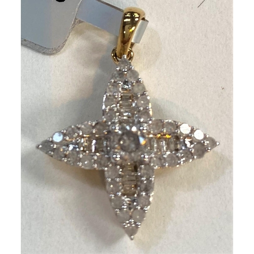 673 - A '9K' gold pendant in the form of a cross, set multi diamonds, by Thomas Rae, total 0.75 carats