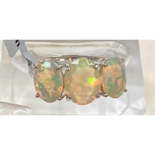 677 - A 9 carat white gold dress ring set 3 oval Kelayi opals, total opal weight 2.73 carats, size N/O; a ... 