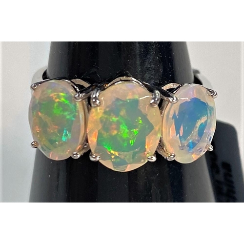 677 - A 9 carat white gold dress ring set 3 oval Kelayi opals, total opal weight 2.73 carats, size N/O; a ... 