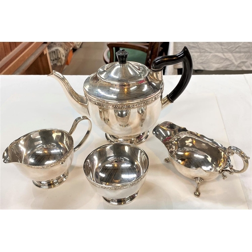 716 - A hallmarked silver sauce boat, Birmingham 1938, 2.5oz; a silver plated 3 piece tea set