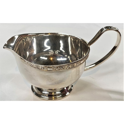 716 - A hallmarked silver sauce boat, Birmingham 1938, 2.5oz; a silver plated 3 piece tea set