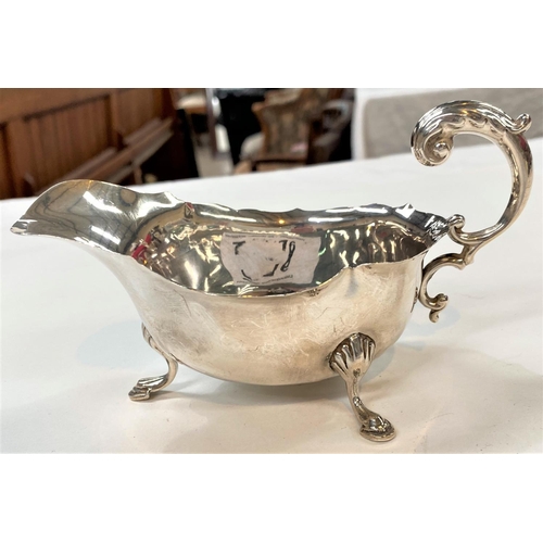 716 - A hallmarked silver sauce boat, Birmingham 1938, 2.5oz; a silver plated 3 piece tea set