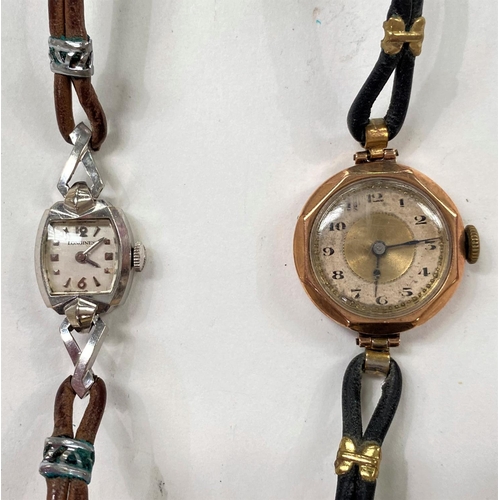 727 - An early 20th century lady's octagonal wristwatch in 9 carat hallmarked gold, on leather strap; a la... 