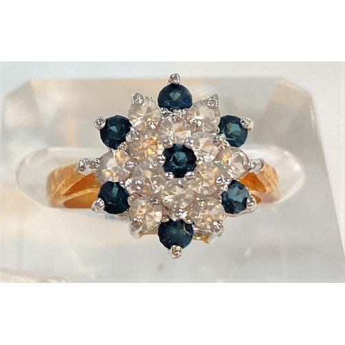 738 - A yellow metal ring set large blue stone, stamped '14k', 3.9gm; a cluster ring set blue/clear stones