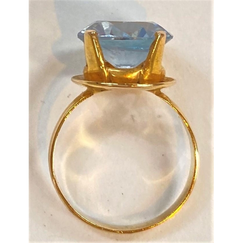 738 - A yellow metal ring set large blue stone, stamped '14k', 3.9gm; a cluster ring set blue/clear stones