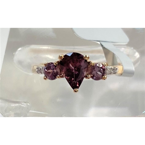 665 - A 9 carat gold dress ring set Bekily colour change garnets with small diamonds to each shoulder, siz... 