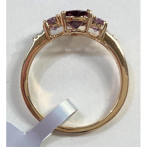 665 - A 9 carat gold dress ring set Bekily colour change garnets with small diamonds to each shoulder, siz... 