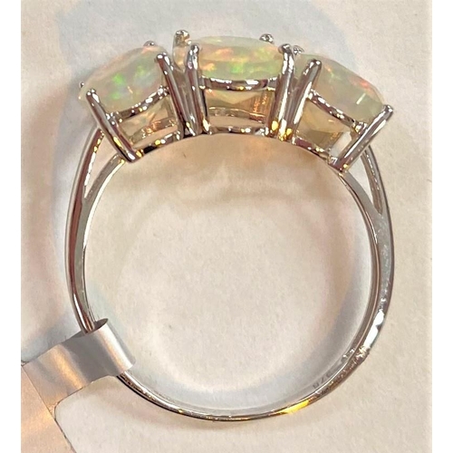 677 - A 9 carat white gold dress ring set 3 oval Kelayi opals, total opal weight 2.73 carats, size N/O; a ... 