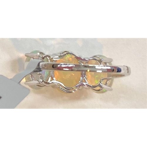 677 - A 9 carat white gold dress ring set 3 oval Kelayi opals, total opal weight 2.73 carats, size N/O; a ... 