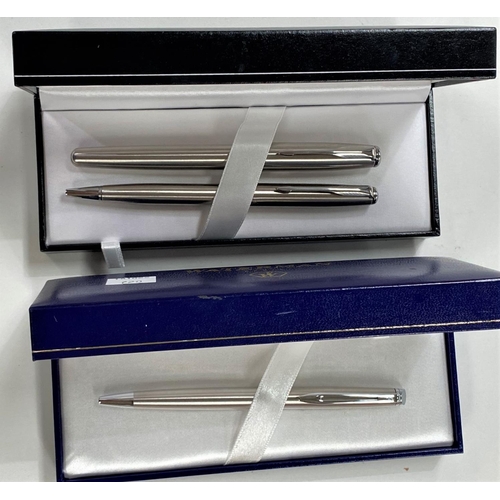 720 - A Parker stainless steel fountain pen and ballpoint pen, in original box; a Waterman ballpoint pen i... 