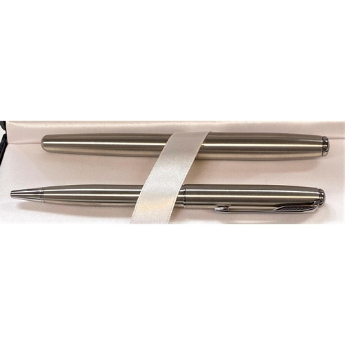 720 - A Parker stainless steel fountain pen and ballpoint pen, in original box; a Waterman ballpoint pen i... 