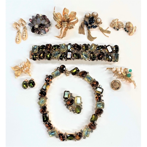 729 - A mid 20th century selection of gilt metal costume jewellery:  Dior; Trifari; Kramer; Boucher; ... 