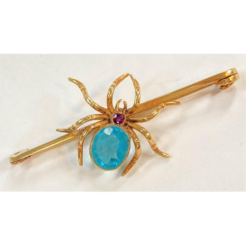 733 - A spider bar brooch set light blue stone, stamped '18ct', 8.75 gm