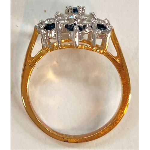 738 - A yellow metal ring set large blue stone, stamped '14k', 3.9gm; a cluster ring set blue/clear stones