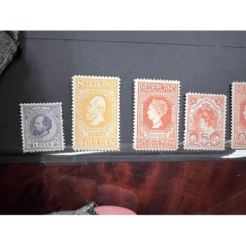 417 - Netherlands. 7 high value mint stamps on stkcrd.  1872 1g, 1891 both 50c, 1913 5g & 10g, 1919 Bo... 