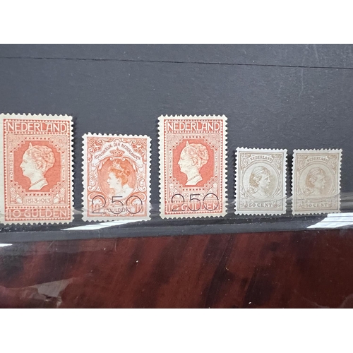 417 - Netherlands. 7 high value mint stamps on stkcrd.  1872 1g, 1891 both 50c, 1913 5g & 10g, 1919 Bo... 