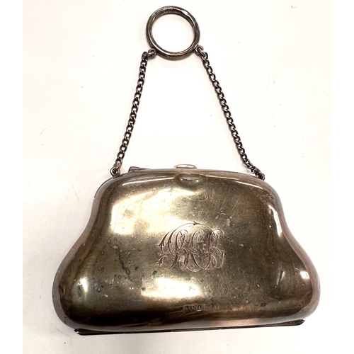 706 - A hallmarked silver purse on the form of a  hand bag;  three hallmarked silver napkin ring... 