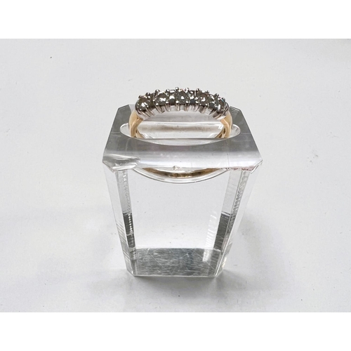 710 - An 18 carat hallmarked gold ring set with 5 diamonds, approximately 3mm, 3 gm gross, size Q