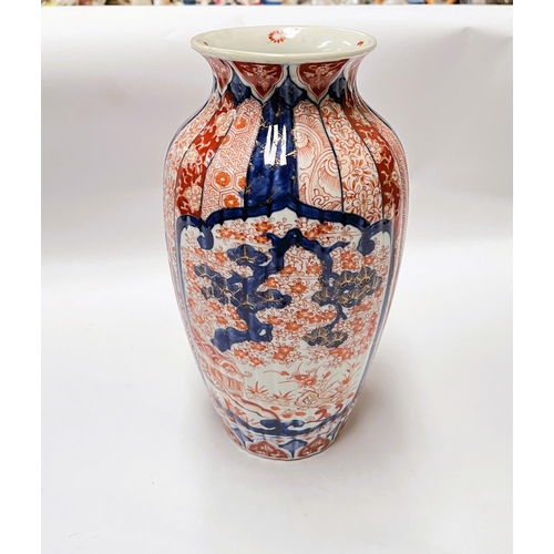 440 - A 19th century Japanese Imari pattern ribbed vase, heigt 24cm