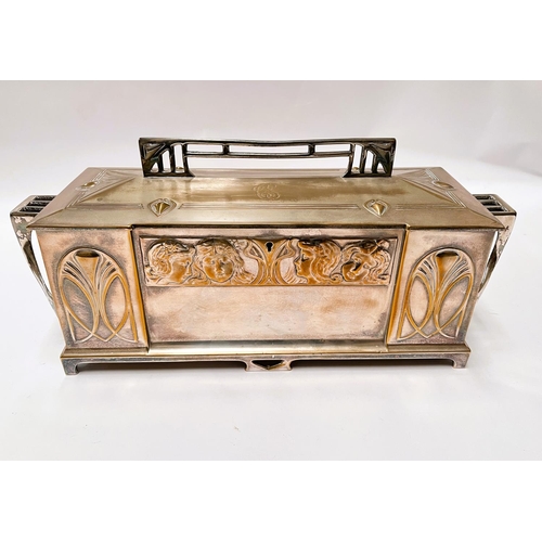 703 - An Art Deco silver plate WMF 'Four Seasons' jewellery casket with embossed faces, length 43cm