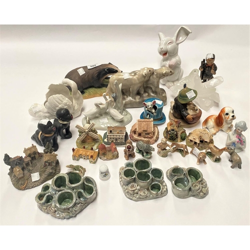 588 - A Lladro polar bear; an Aynsley badger; other animals and figures