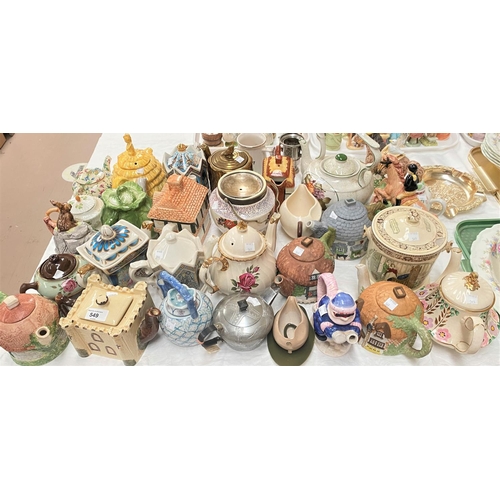 549 - A large collection of novelty and decorative teapots, 34 approx