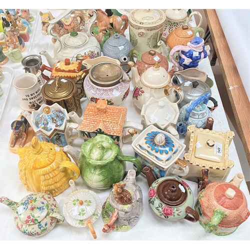 549 - A large collection of novelty and decorative teapots, 34 approx