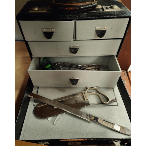 134 - A 20th century doctor's case with an amputation saw and other surgical tools