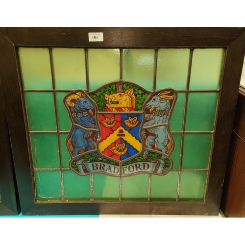 151 - An oak framed stained glass window with the Bradford Coat of Arms surrounded by green glass  49... 