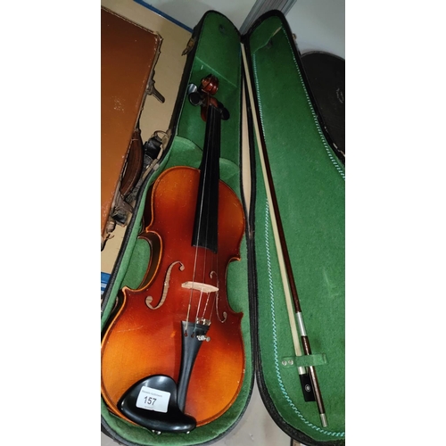 157 - A full size Spruce4 top 2 piece maple backed violin in hard carry case with a bow with mother of pea... 