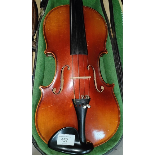 157 - A full size Spruce4 top 2 piece maple backed violin in hard carry case with a bow with mother of pea... 