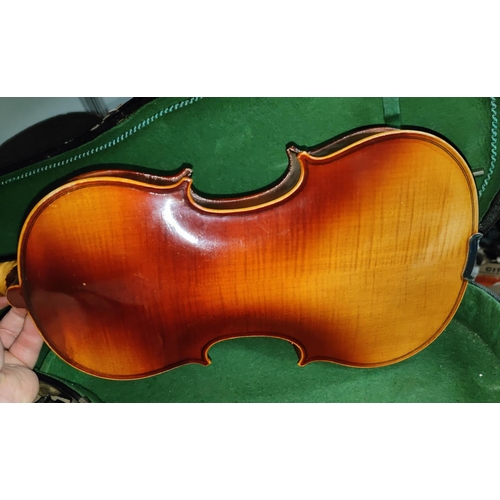 157 - A full size Spruce4 top 2 piece maple backed violin in hard carry case with a bow with mother of pea... 