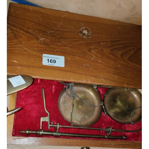 169 - A set of balance scales in a drawer case, a brass desk plane, other planes and cars etc